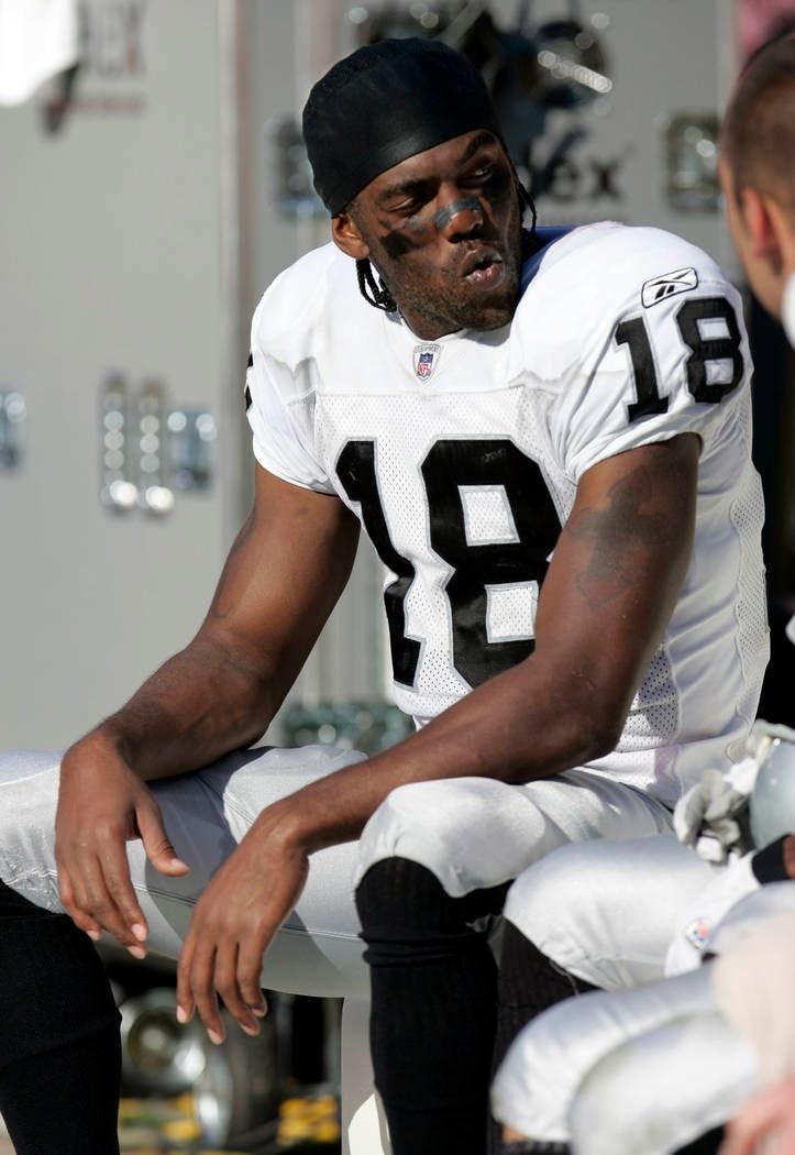 Oakland Raiders wide receiver Randy Moss sits on the bench late in the fourth quarter of their NFL football game against the San Francisco 49ers, Sunday, Oct. 8, 2006, in San Francisco. The 49ers ...