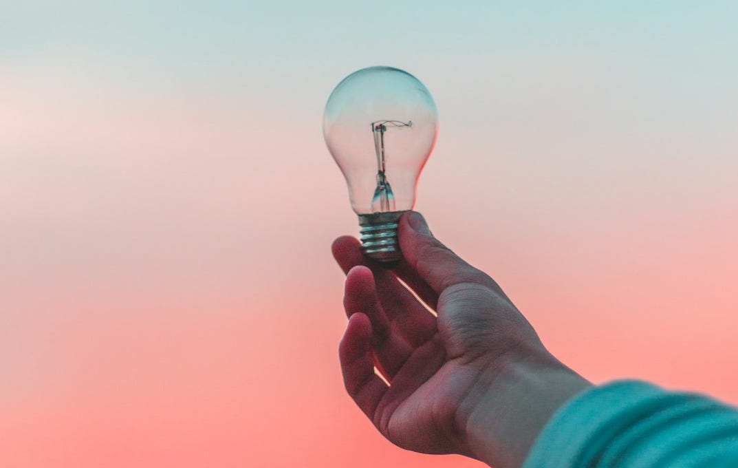 person holding light bulb