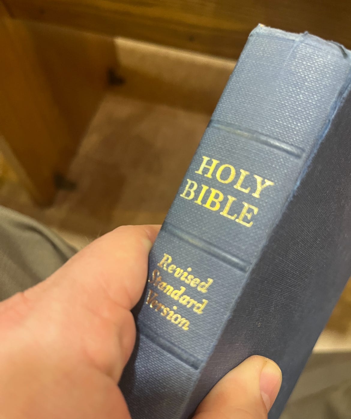 An old copy of a bible in my hands 