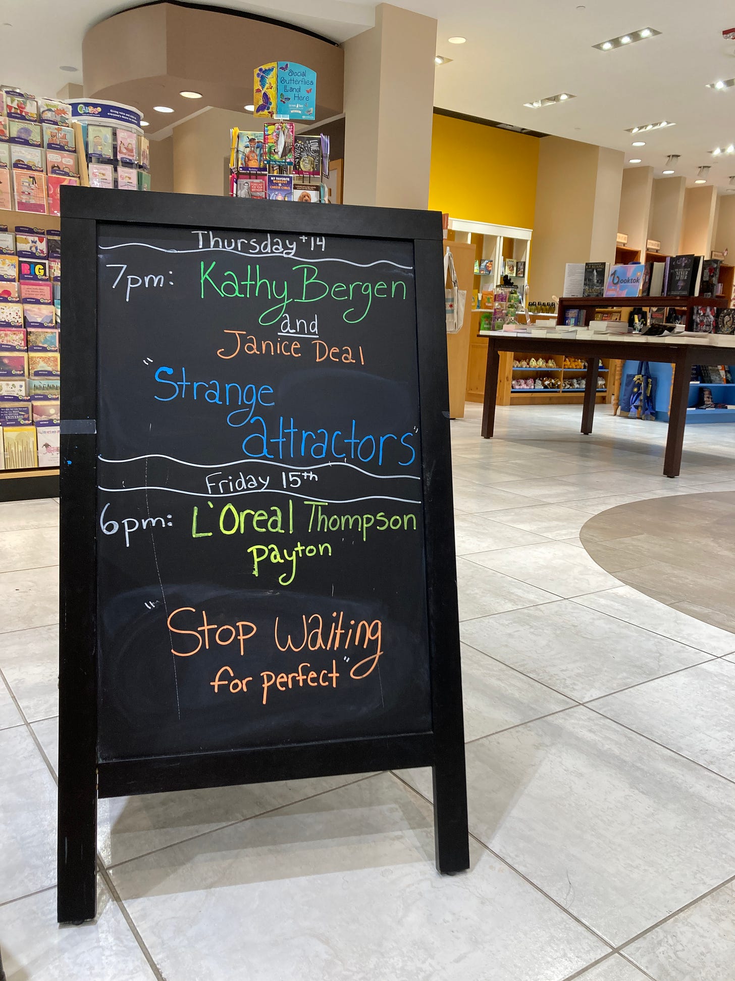 Picture of a sign promoting author events at a bookstore