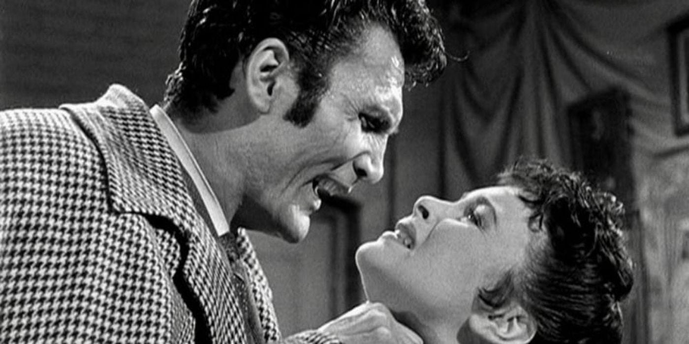 Jack Palance angrily grabs a woman in the Man in the Attic