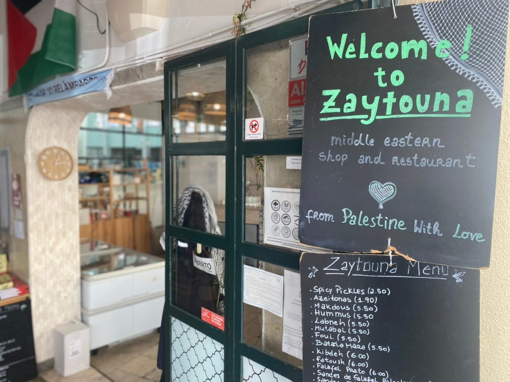 A sign with menu outside a Palestinian restaurant