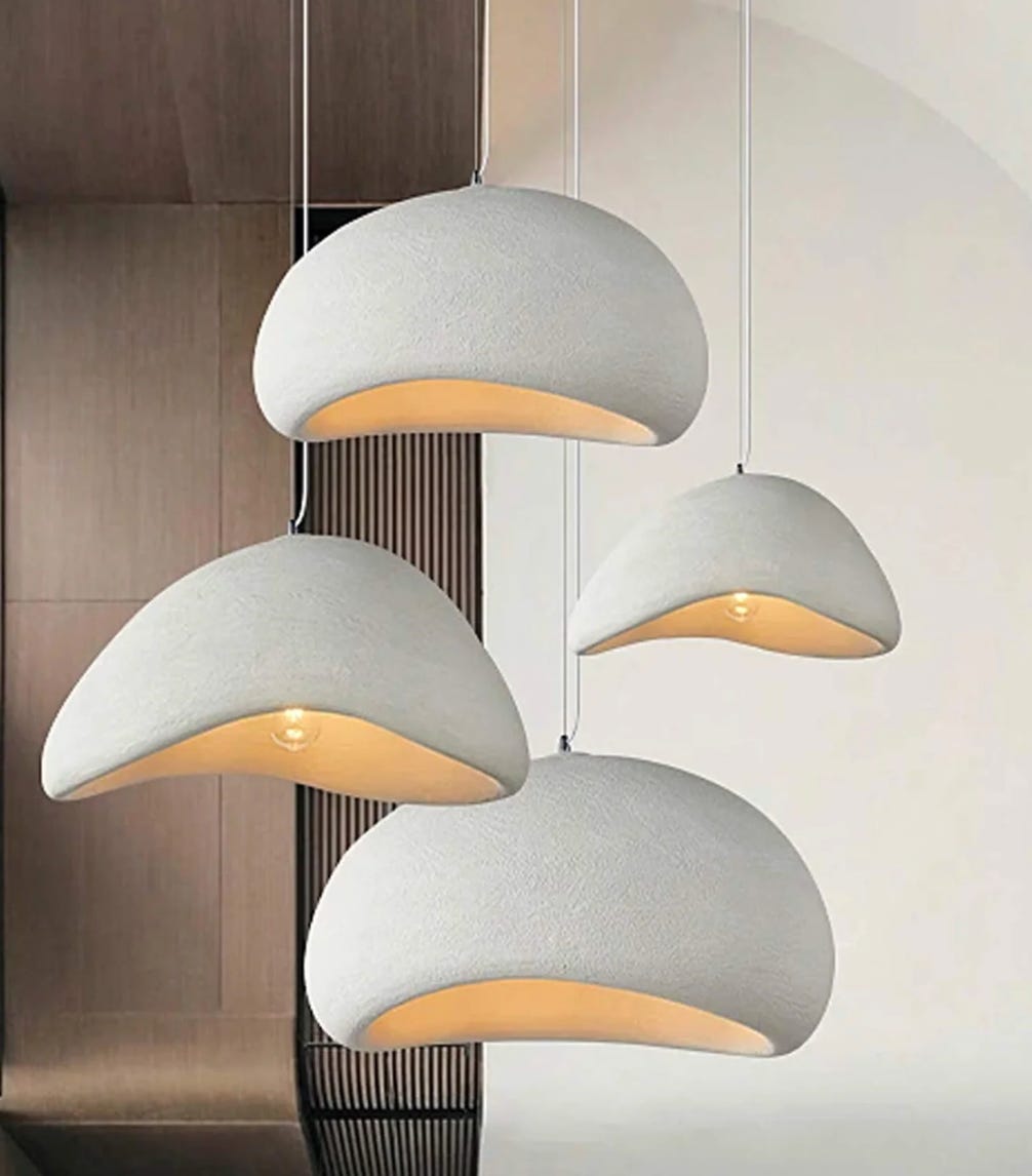 Domed white pendants gathered in a cluster