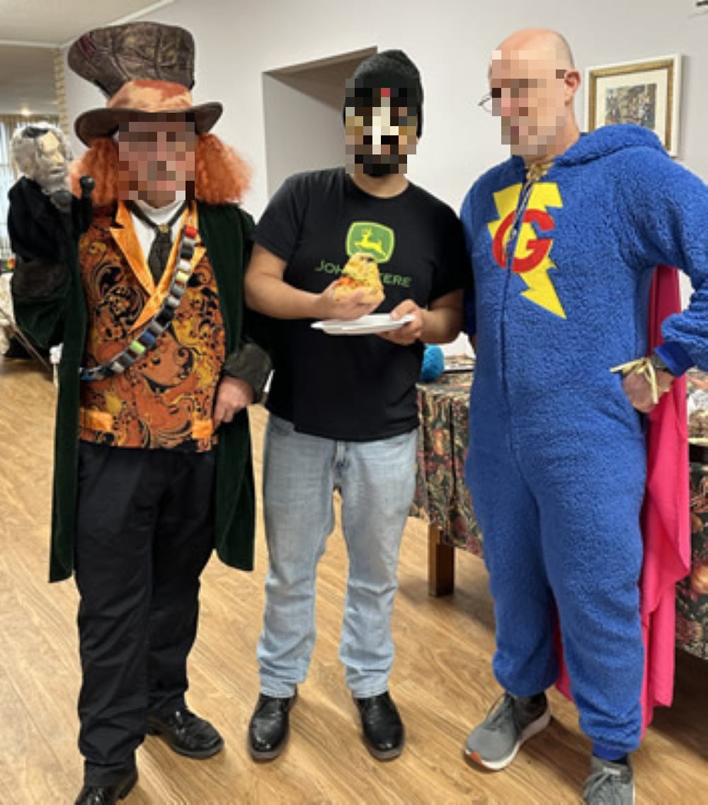 Three adults in costume at Purim party