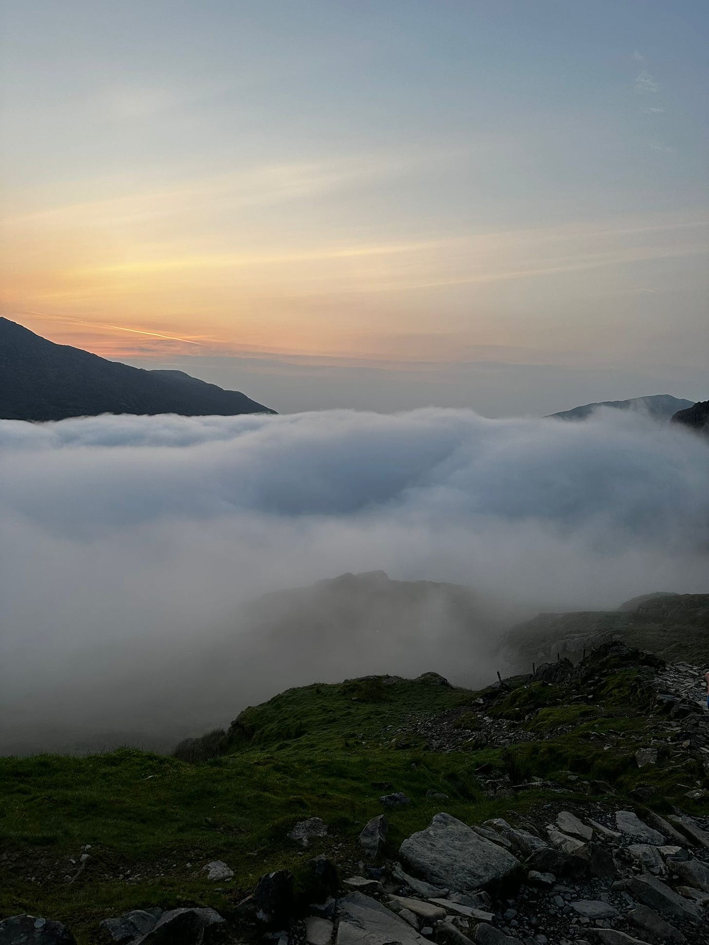 A photo of the mountains above the clouds.