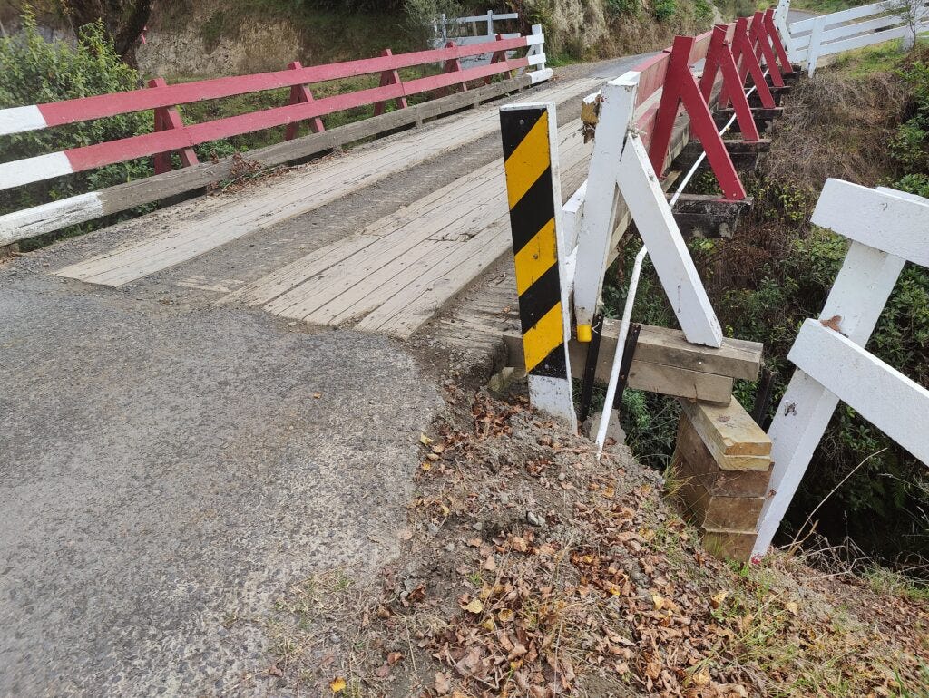 One-lane wooden bridge resting on makeshift pile