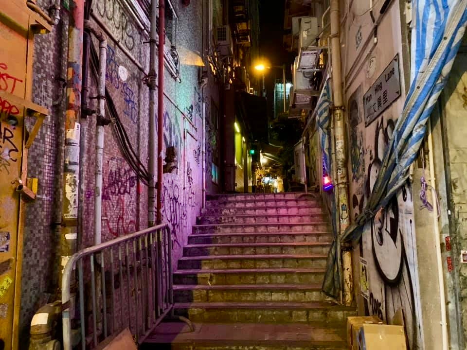 Narrow steps between buildings at night