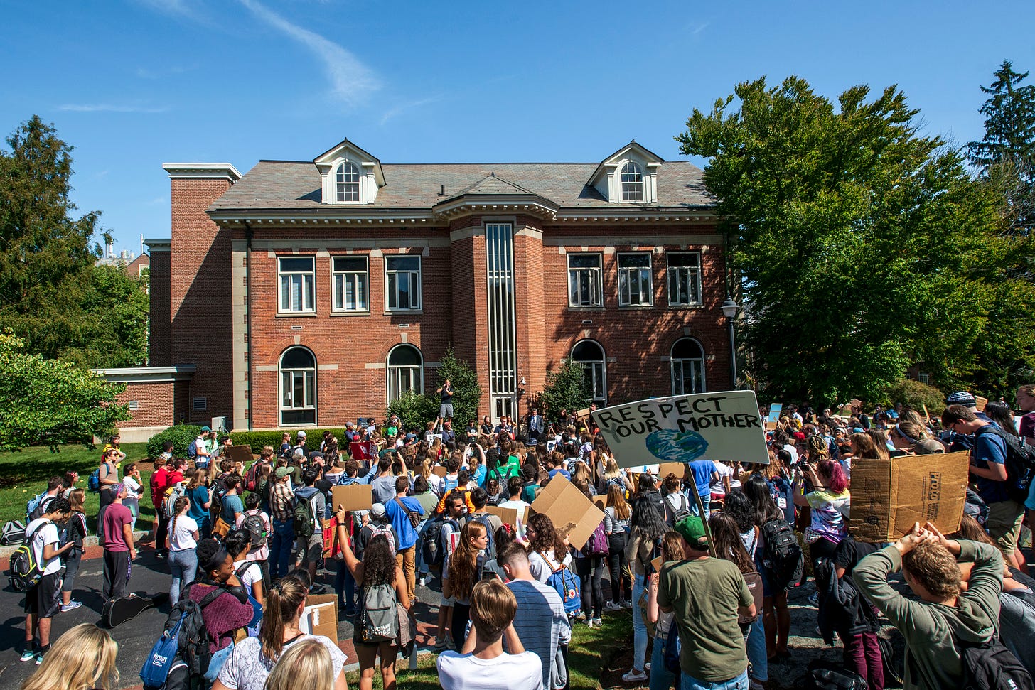 President Katsouleas talks with students about the Climate Strike outside Gulley Hall on Sept. 20, 2019. (Sean Flynn/UConn Photo)