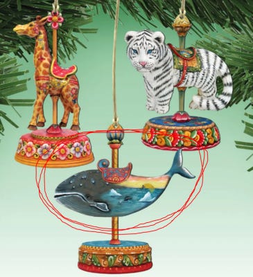 3 ornaments -- giraffe, tiger, and whale with a circle drawn around it