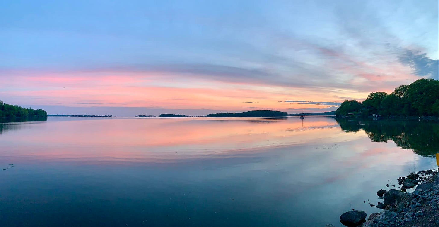 May be an image of lake and twilight