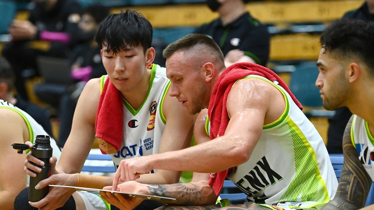Mitchell Creek of the Phoenix explains a play to Zhou Qi of the Phoenix during the NBL Blitz match between Sydney Kings and South East Melbourne Phoenix at MSAC on November 13, 2021, in Melbourne, Australia. (Photo by Quinn Rooney/Getty Images) Mitchell Creek of the Phoenix explains a play to Zhou Qi of the Phoenix during the NBL Blitz match between Sydney Kings and South East Melbourne Phoenix at MSAC on November 13, 2021, in Melbourne, Australia. (Photo by Quinn Rooney/Getty Images)
