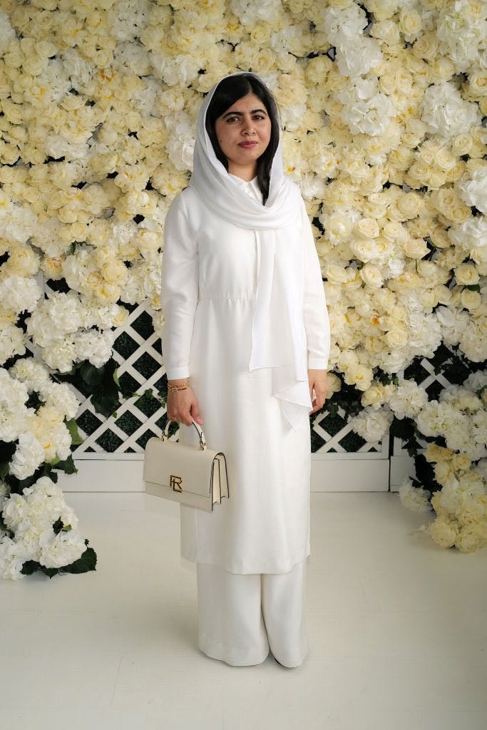 Malala Yousafzai in a white top, pants, and hijab celebrities at wimbledon 2023