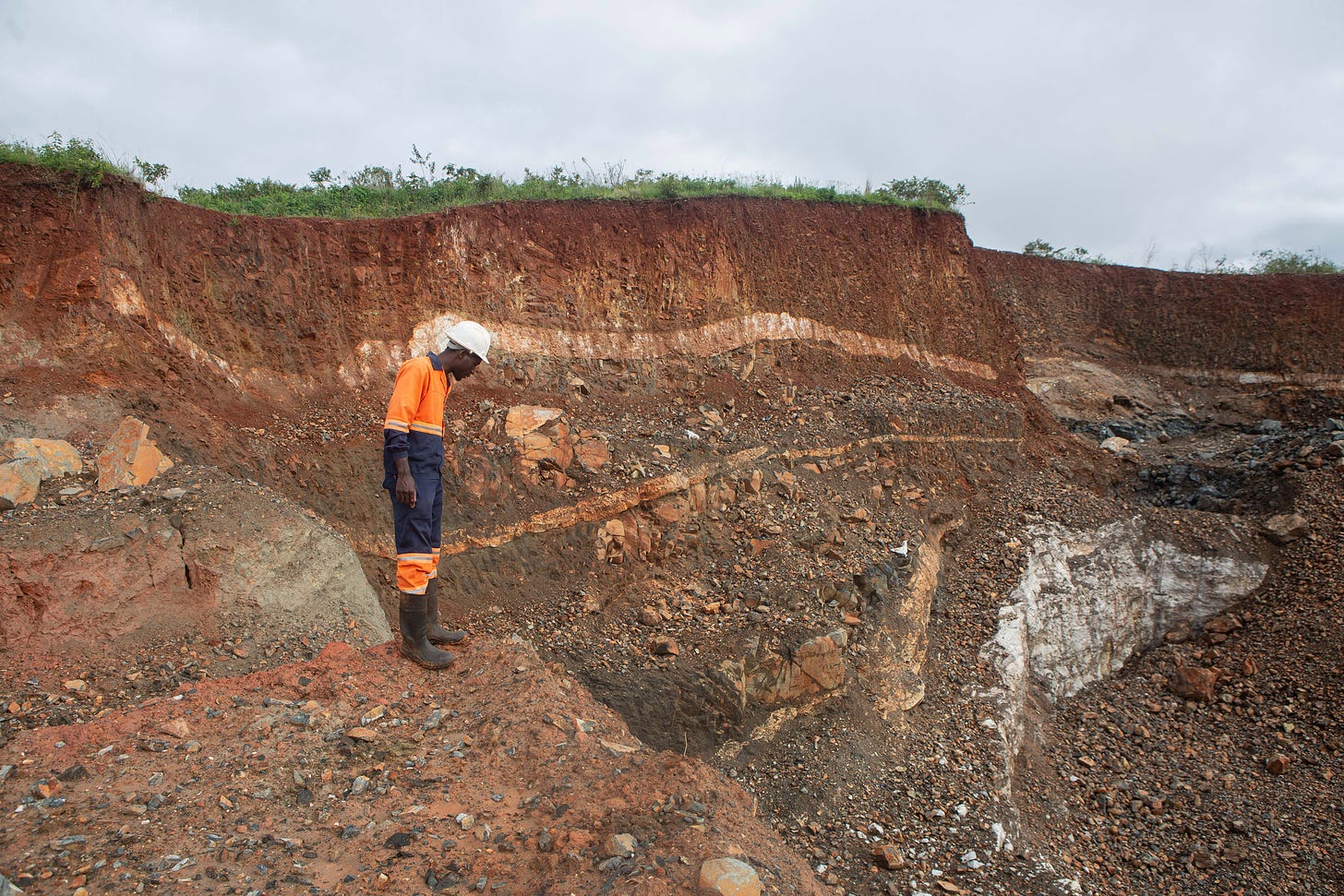 A worker inspects an open cast at Arcadia Lithium Mine in Goromonzi, Zimbabwe. Credit: Tafadzwa Ufumeli/Getty Images
