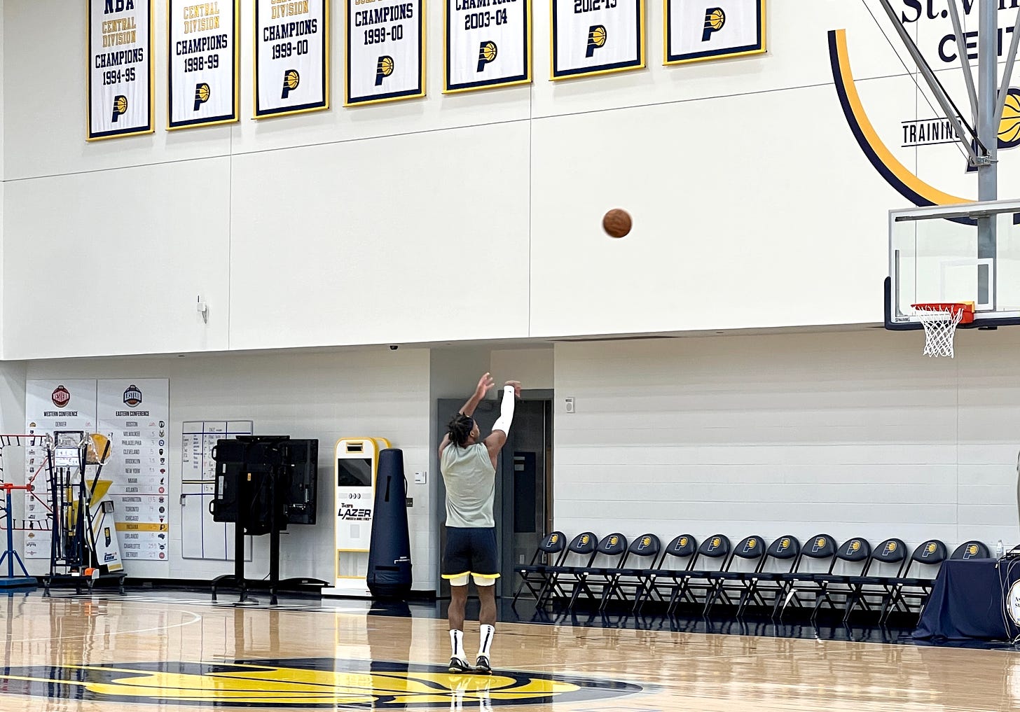 Pacers guard Buddy Hield shooting alone at a basket.