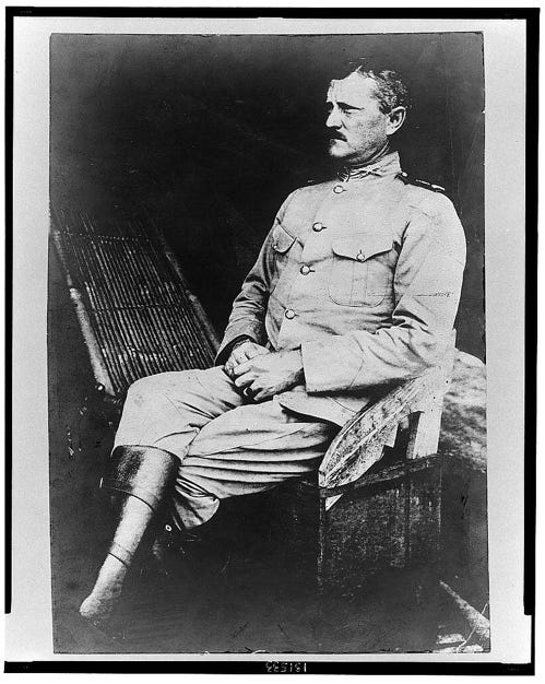 Photo of Captain John Pershing, 15th Cavalry--Moro Conqueror in Mindanao. Black and white, photo, seated full length and left profile.  