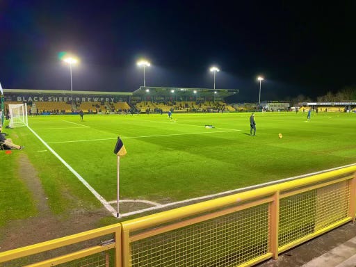 The pitch at the Envirovent Stadium with a corner flag in the foreground.