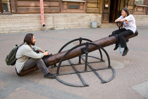 Couple on teeter totter