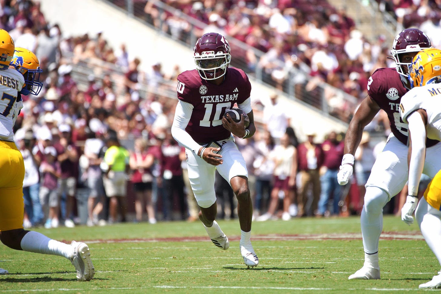 Sep 7, 2024; College Station, Texas, USA; Texas A&M Aggies quarterback Marcel Reed (10) runs the ball against the McNeese State Cowboys during the second quarter at Kyle Field. Mandatory Credit: Dustin Safranek-Imagn Images