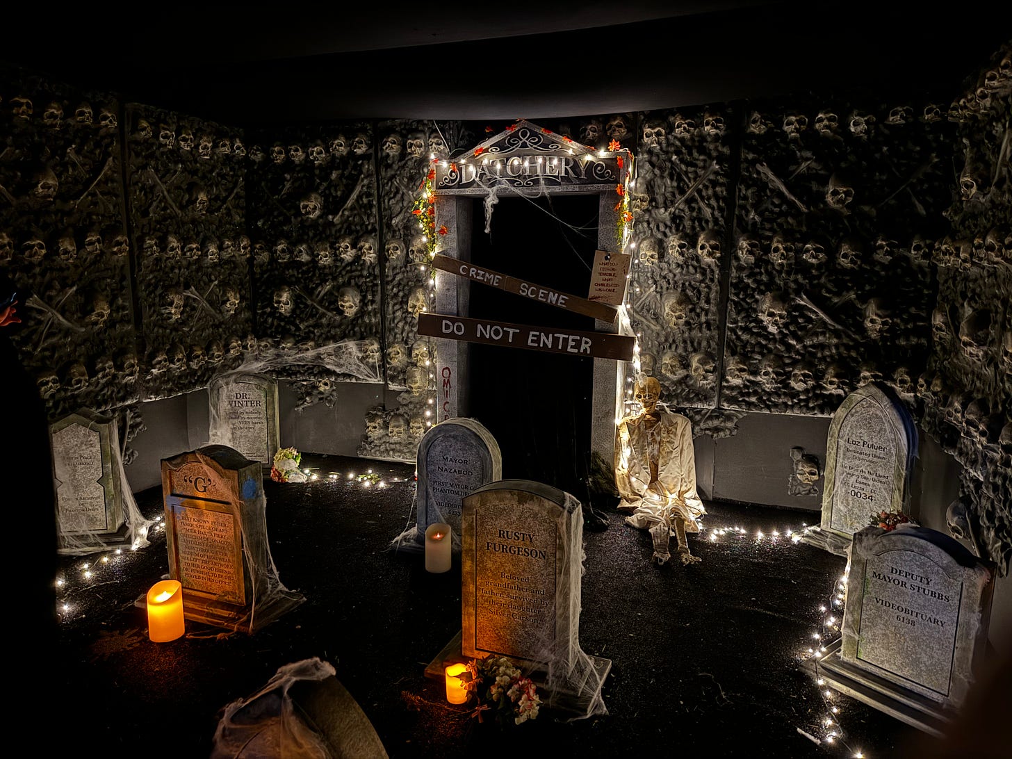 A dark crypt with gravestones each with codes and words