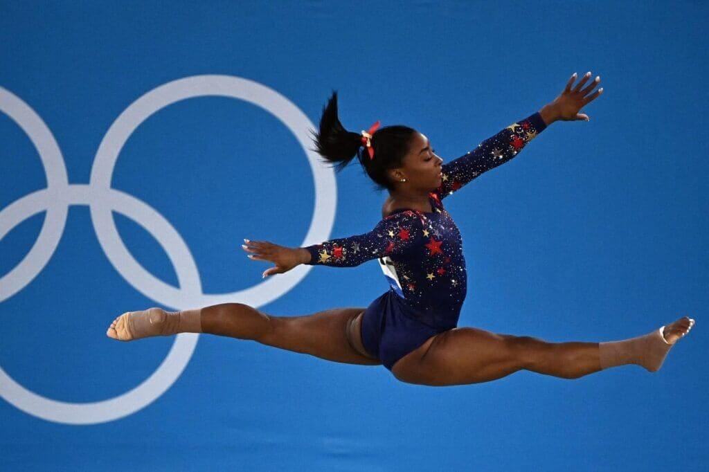 USA&#039;s Simone Biles competes in the floor event of the artistic gymnastic women&#039;s qualification during the Tokyo 2020 Olympic Games at the Ariake Gymnastics Centre in Tokyo on July 25, 2021. (Photo by Lionel BONAVENTURE / AFP) (Photo by LIONEL BONAVENTURE/AFP via Getty Images)