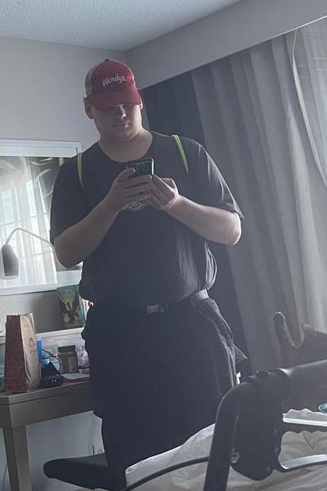 May be an image of 1 person and phone