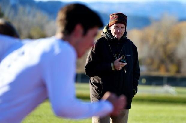 Colorado cross country coach Mark Wetmore starts his stopwatch as...