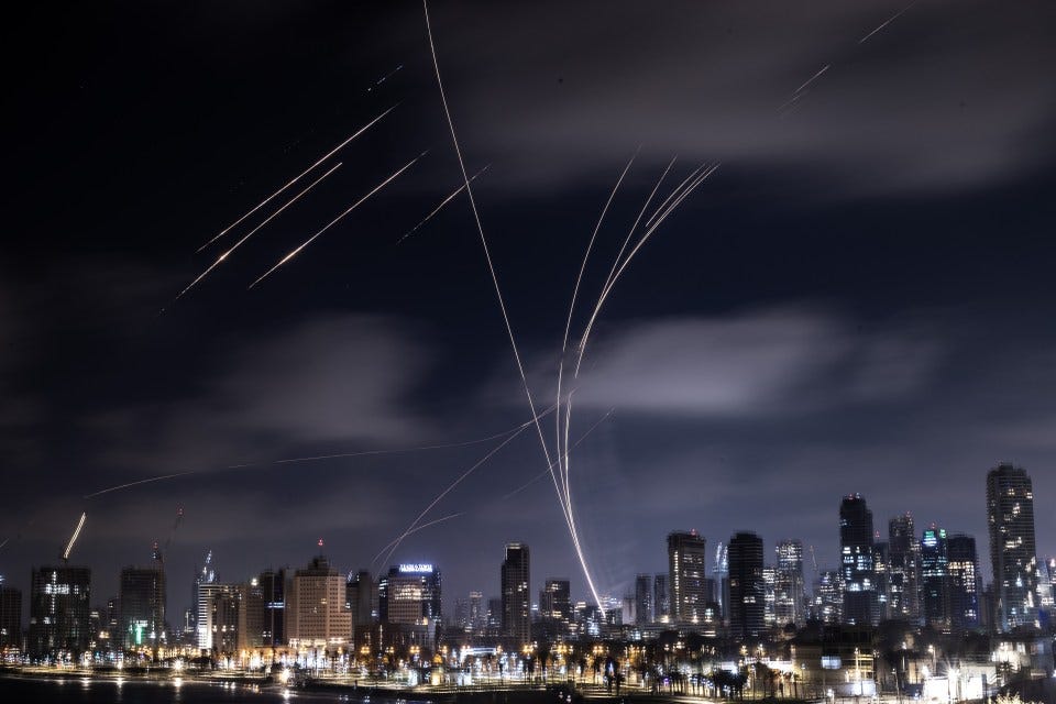 Ballistic missiles over Tel Aviv at night.