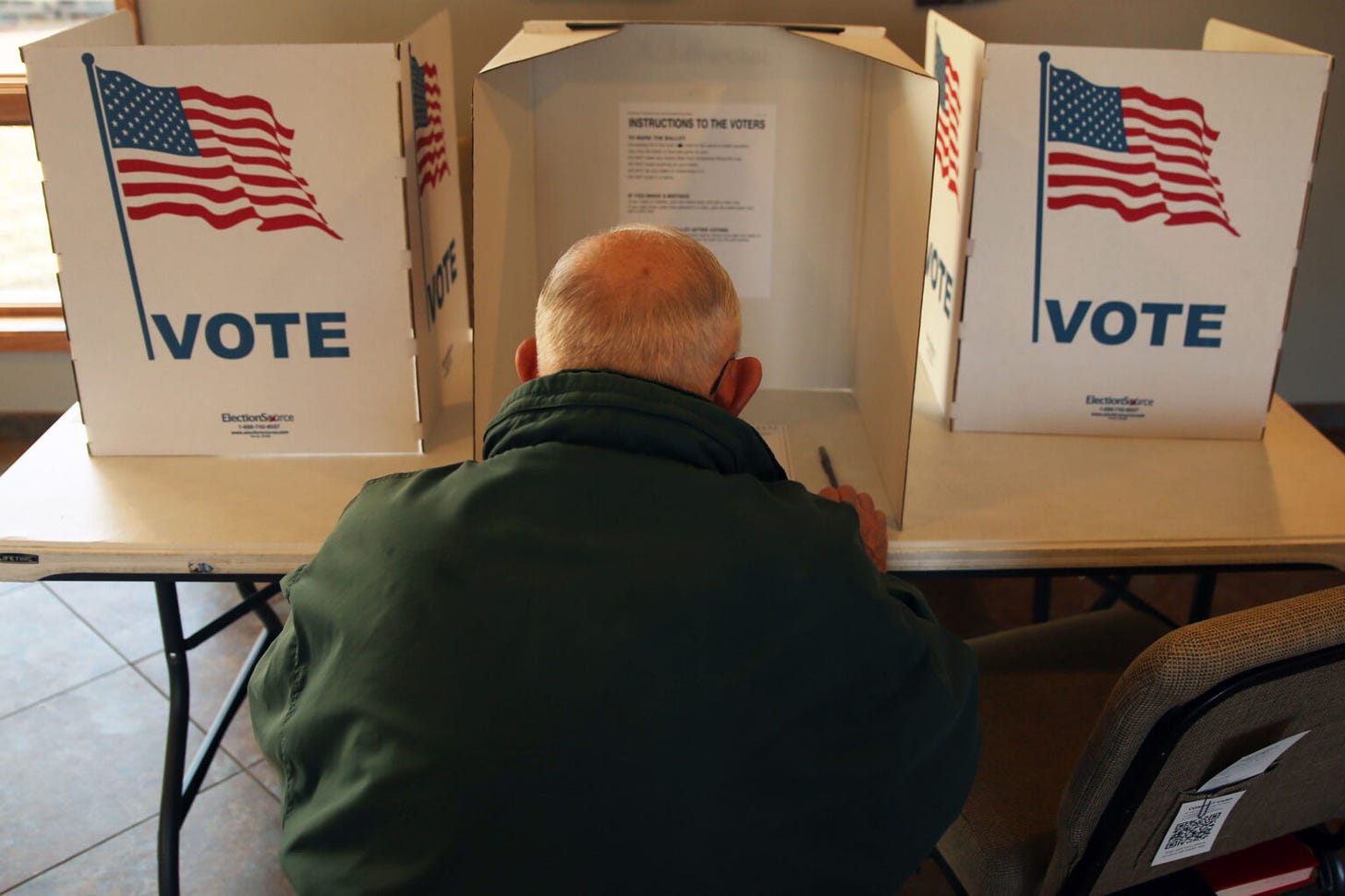 A Sioux Falls resident votes in the city and school board election at Southern Hills United Methodist Church on April 9, 2024. (Makenzie Huber/South Dakota Searchlight)