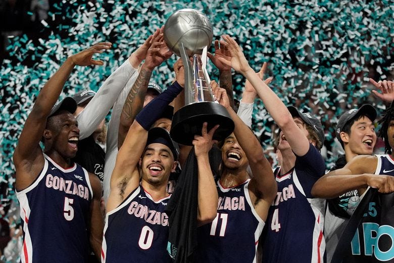 Gonzaga players celebrate after defeating Saint Mary&#8217;s in an NCAA college basketball championship game in the West Coast Conference men&#8217;s tournament Tuesday, March 11, 2025, in Las Vegas. (AP Photo/John Locher)