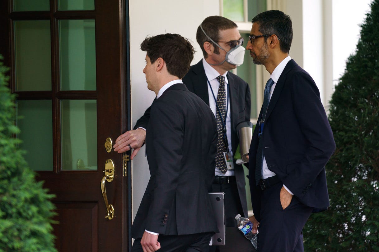 Alphabet CEO Sundar Pichai (right) and OpenAI CEO Sam Altman (left) walking into the White House.