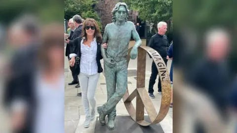 Laura Lian Laura Lian with the John Lennon Peace Statue