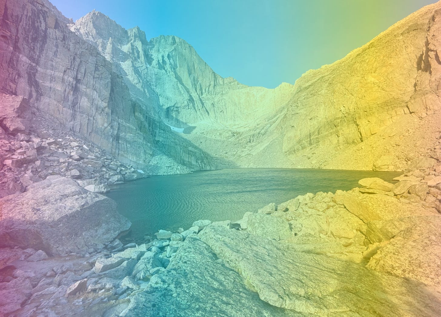 A rainbow-filtered image of Chasm Lake in Rocky Mountain National Park