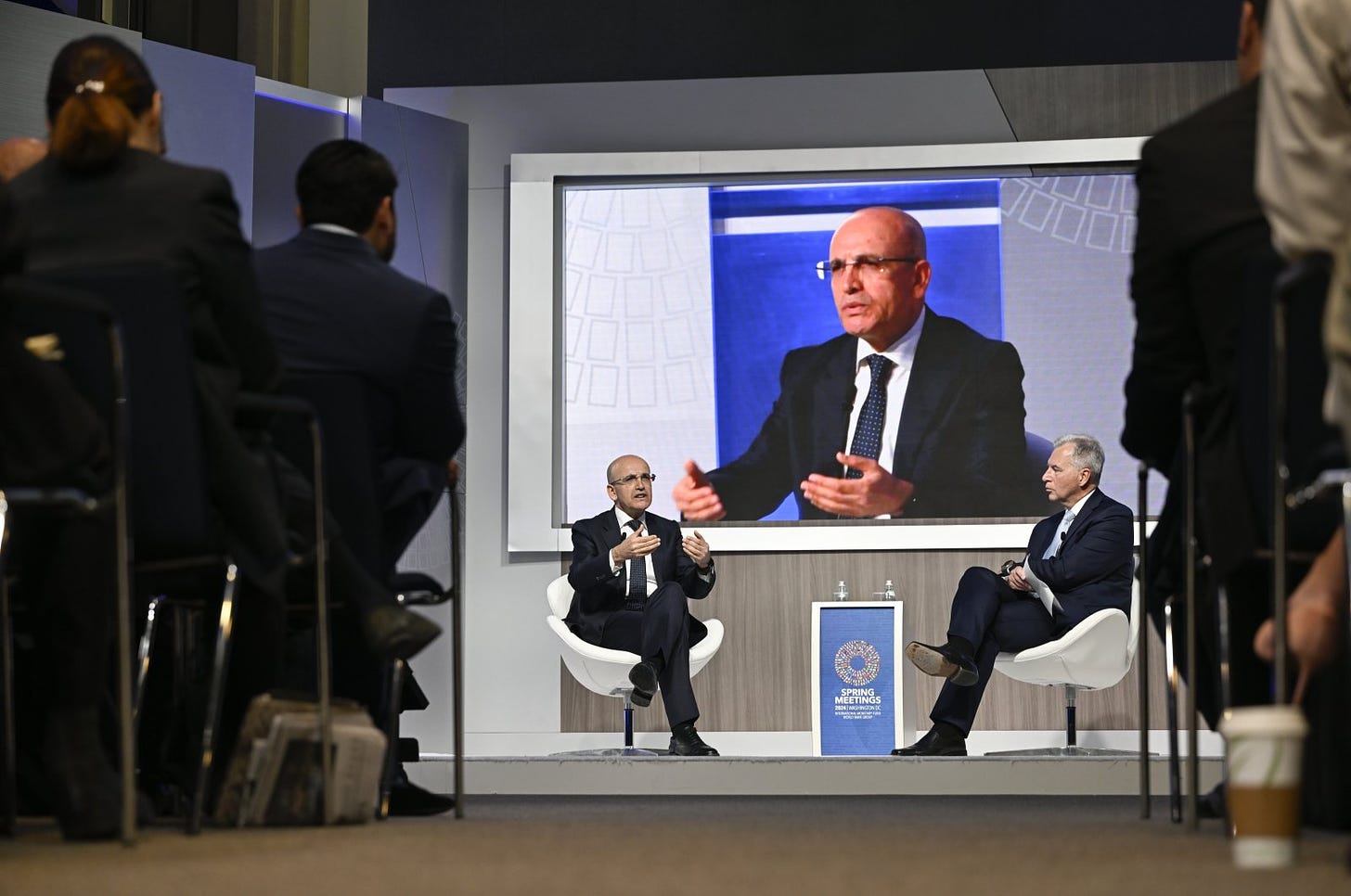 Treasury and Finance Minister Mehmet Şimşek speaks during an event on the sidelines of the International Monetary Fund-World Bank spring meetings, Washington, U.S., April 18, 2024. (AA Photo)