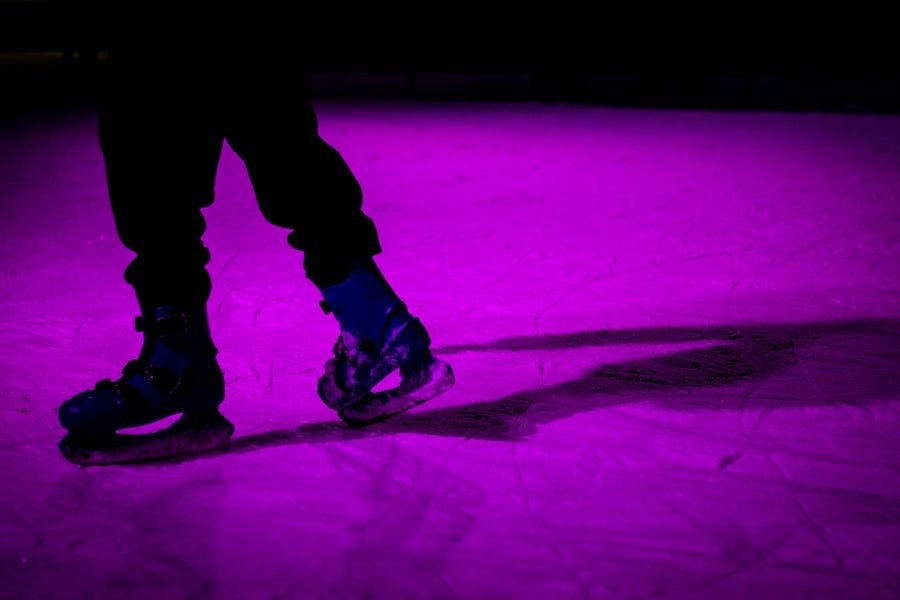 legs of a person wearing skates legs of a person wearing skates