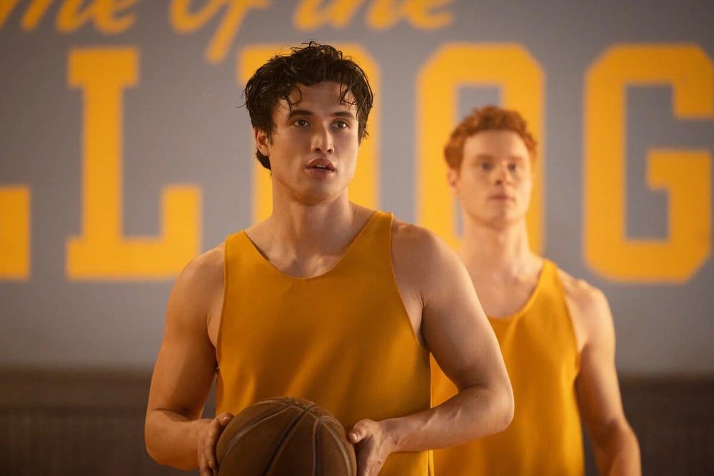 Reggie Mantle and Julian Blossom playing basketball.