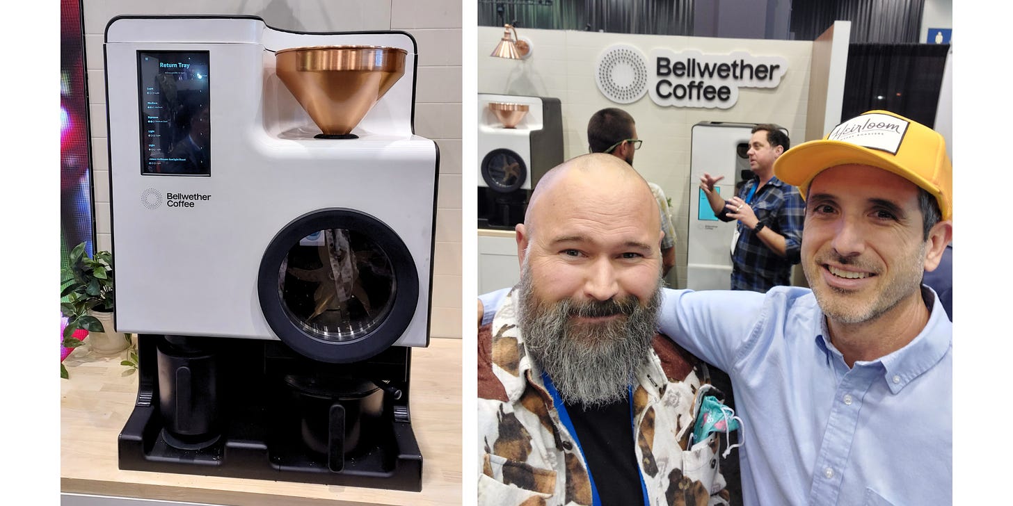 Left: A close-up of a modern, electric coffee roaster. R: A bald, bearded man smiles with a taller thin gentleman in a bright yellow baseball cap in front coffee roasters on a countertop at a convention.