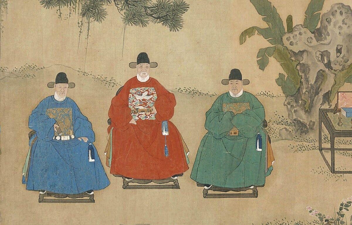 A group of men in traditional clothing

Description automatically generated