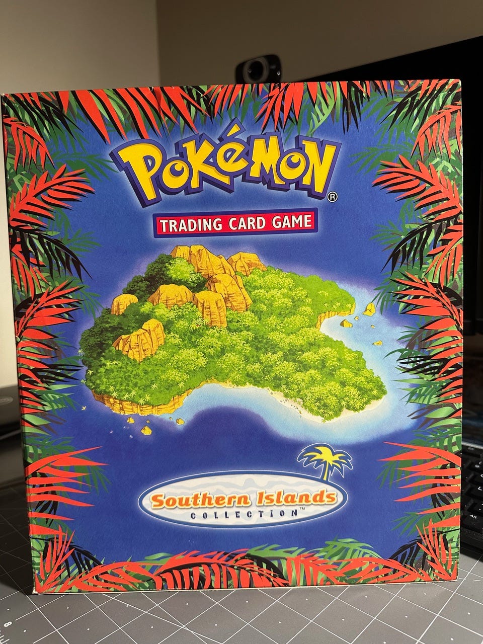 Greg's prized possession that he obtained from the Super Trainer Showdown: the Southern Islands Collection set, which includes eighteen cards, featuring holographic cards such as Togepi and Mew