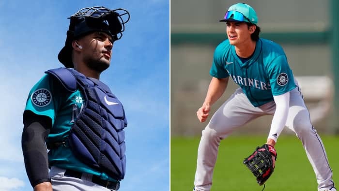 Left: Harry Ford walks in catchers gear. 
Right: Cole Young is crouched with a glove in his hand, wearing grey pants and an aqua Mariners jersey and cap. 