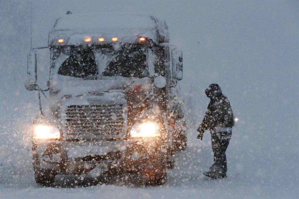 A truck worker in a snowstorm