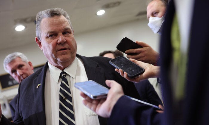 Sen. Jon Tester talks to reporters as he leaves a Senate briefing on China at the U.S. Capitol in Washington, on Feb. 15, 2023. (Kevin Dietsch/Getty Images)
