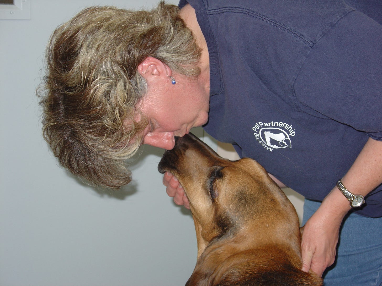 Author kissing her bloodhound Zeke on his nose