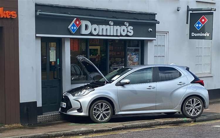 The car on the pavement outside Domino’s in Northgate End. Picture: Toby Kadritzke