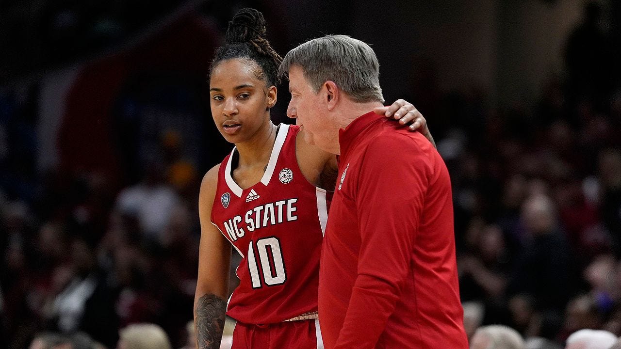 North Carolina State guard Aziaha James (10) reacts with head coach Wes Moore at the end of a Final Four college basketball game against South Carolina in the women's NCAA Tournament, Friday, April 5, 2024, in Cleveland. South Carolina won 78-59. (AP Photo/Morry Gash)