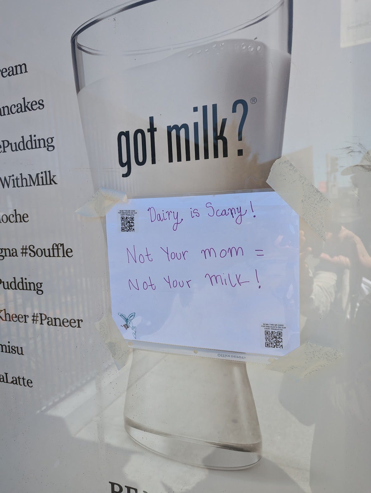 Handwritten note reading "Dairy is scary! Not your mom = not your milk." A QR code supposedly leads to "discounts on our dairy products."