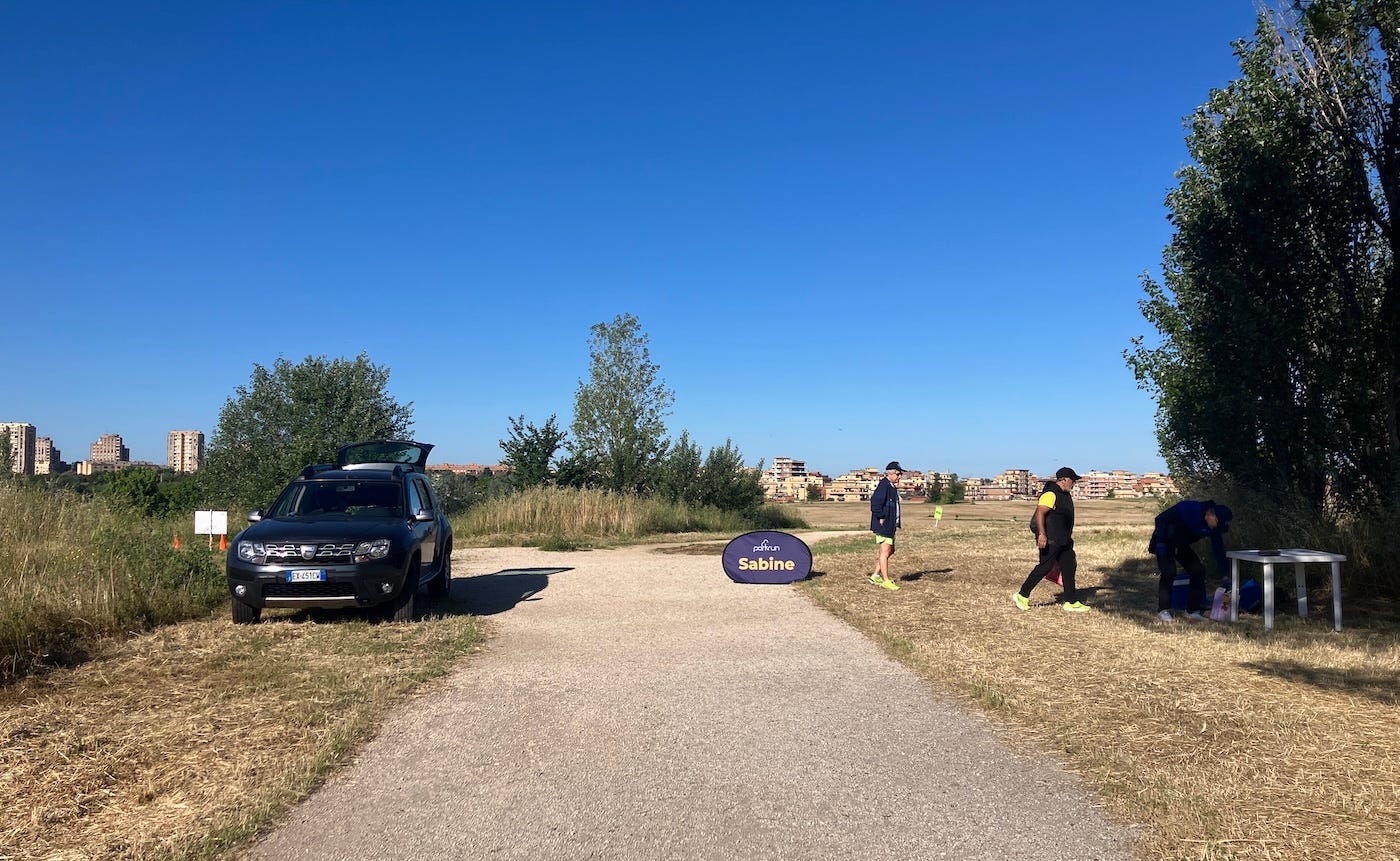 Blue skies over a scrubland park with wide paths