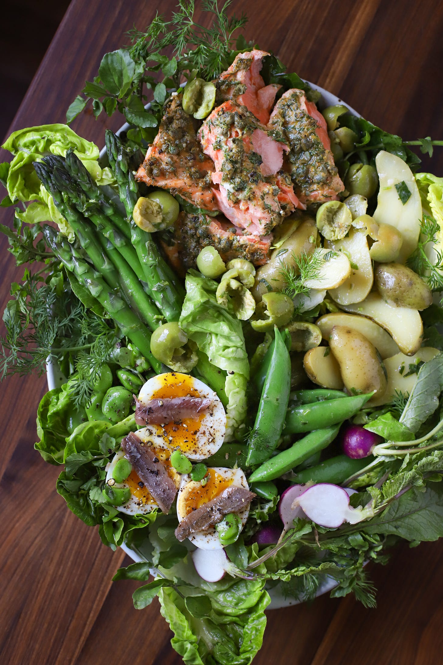 Salad platter with salmon, spring vegetables, and lemon-tarragon dressing