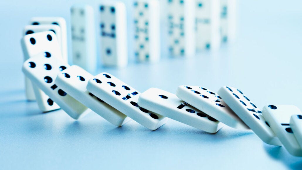 When dominoes fall, how fast the row topples depends on friction