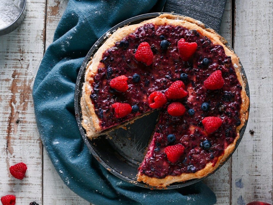 cooked pie with blueberries and strawberries