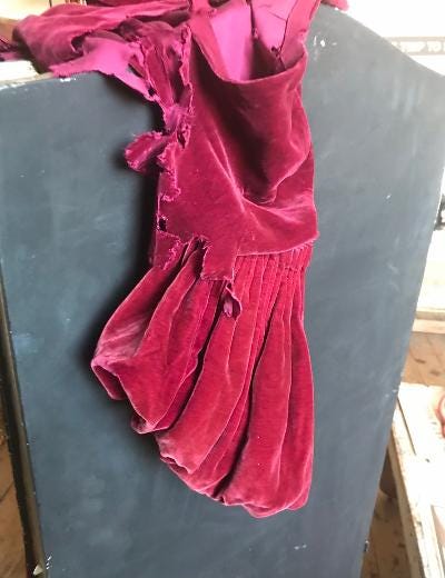 A red dress on a swinger

Description automatically generated with medium confidence